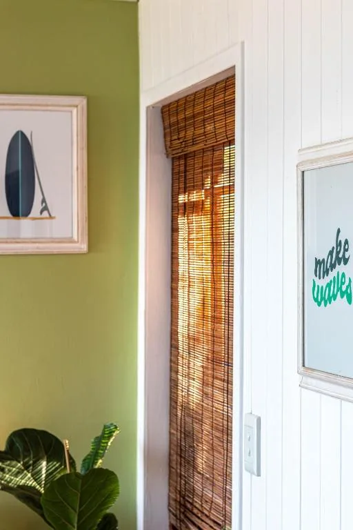 Interior wall decor with surf artwork and coastal-themed wall art