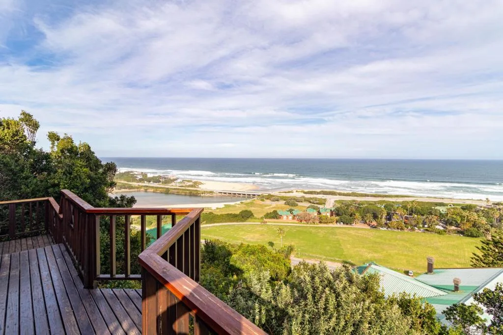 Expansive ocean and beach views from elevated deck railing overlooking Wilderness coastline
