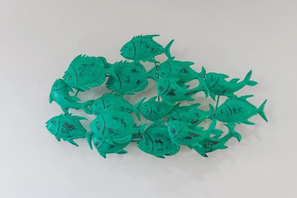 Decorative turquoise fish wall art sculpture mounted indoors
