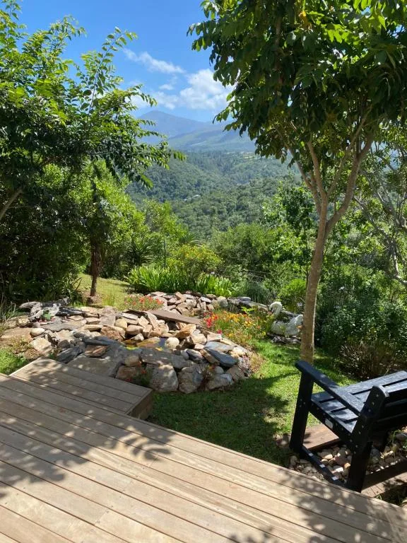 Wooden deck with mountain views and shaded garden seating area