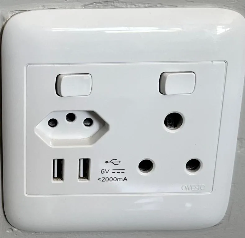 White electrical outlet with USB ports and power sockets installed