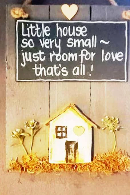 Charming wooden sign with house illustration and romantic welcoming message