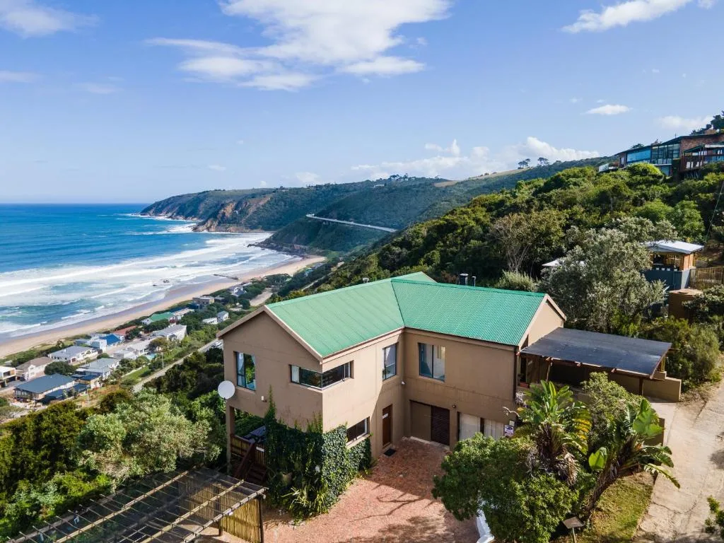 Coastal cliffs and sandy beach visible from property overlooking ocean