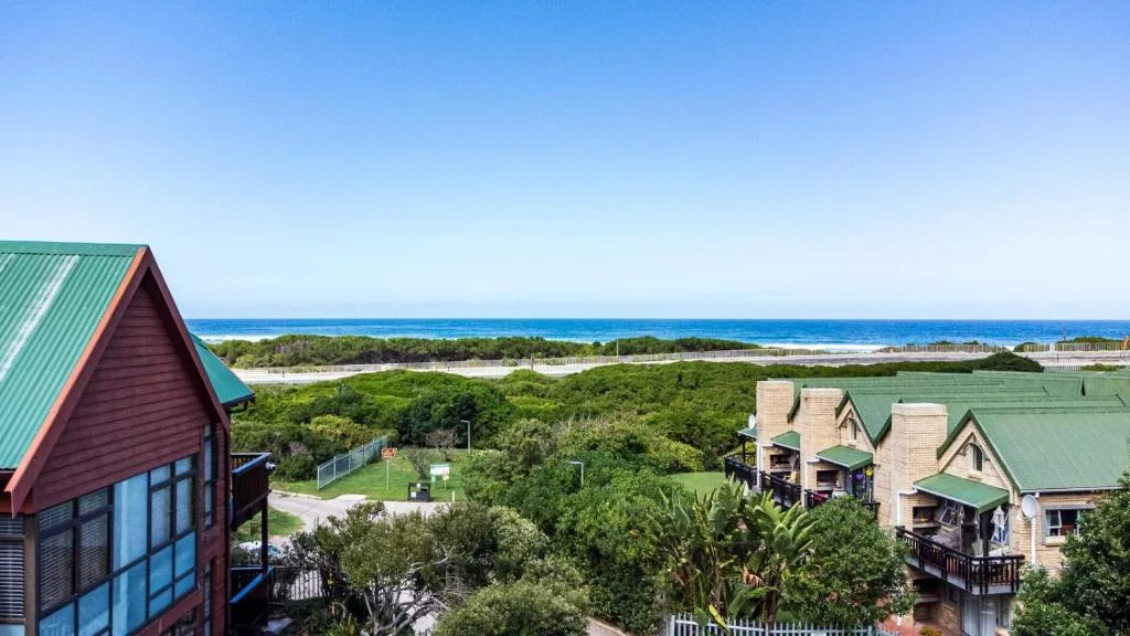 Elevated ocean and lagoon views with lush coastal vegetation and blue sky