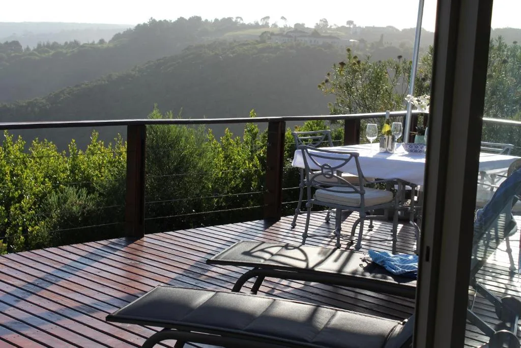Expansive valley and hillside vista from elevated garden route deck
