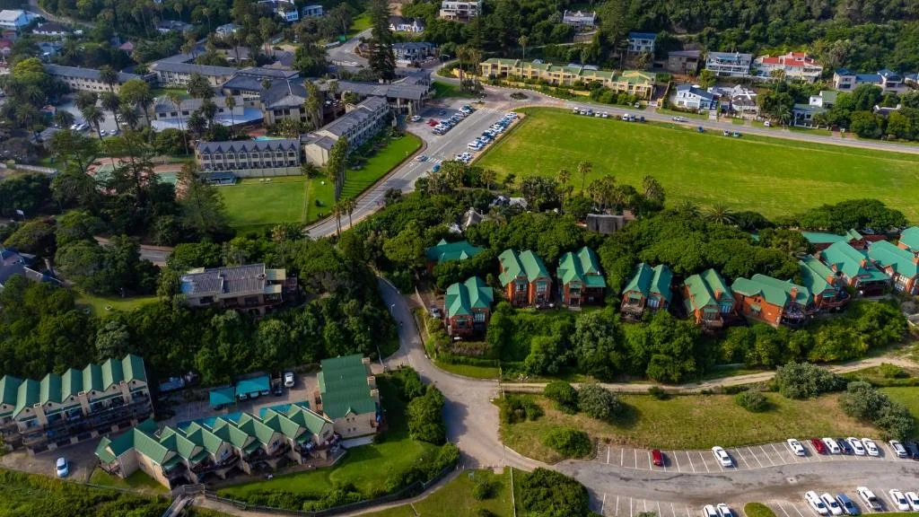 Aerial view of Wilderness resort with distinctive green-roofed cottages nestled among trees