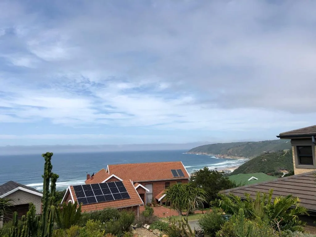 Panoramic ocean and coastal landscape view from elevated property position