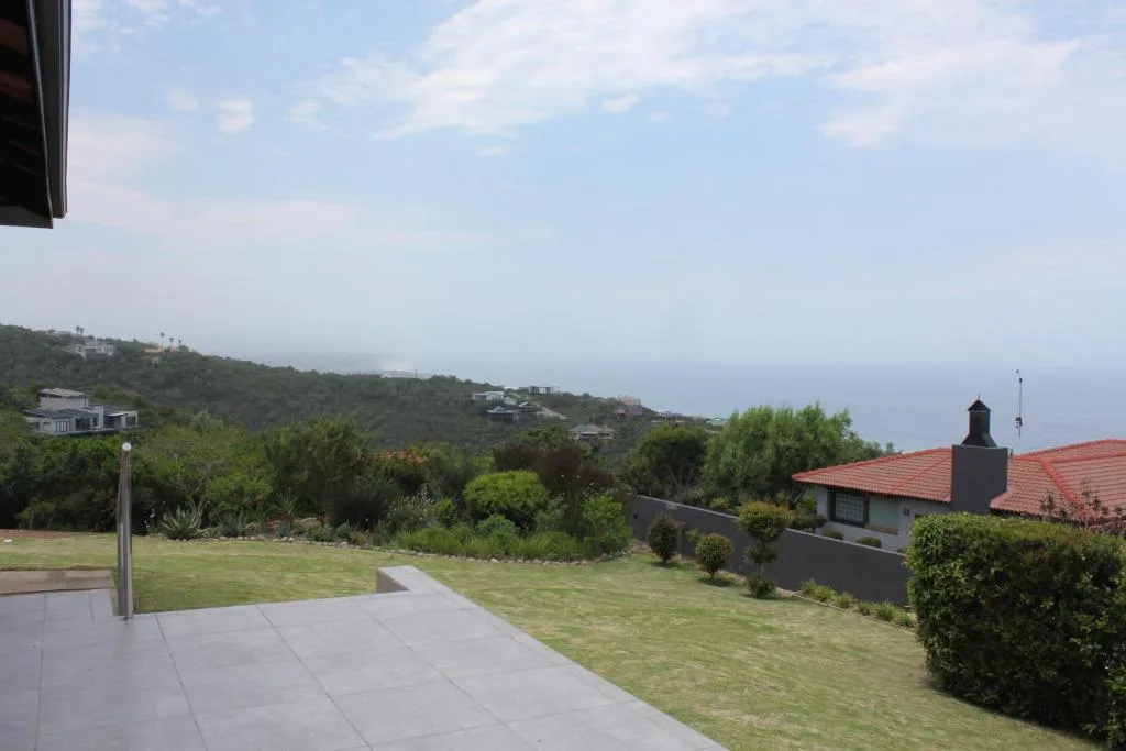 Scenic hillside and ocean vista from expansive garden terrace